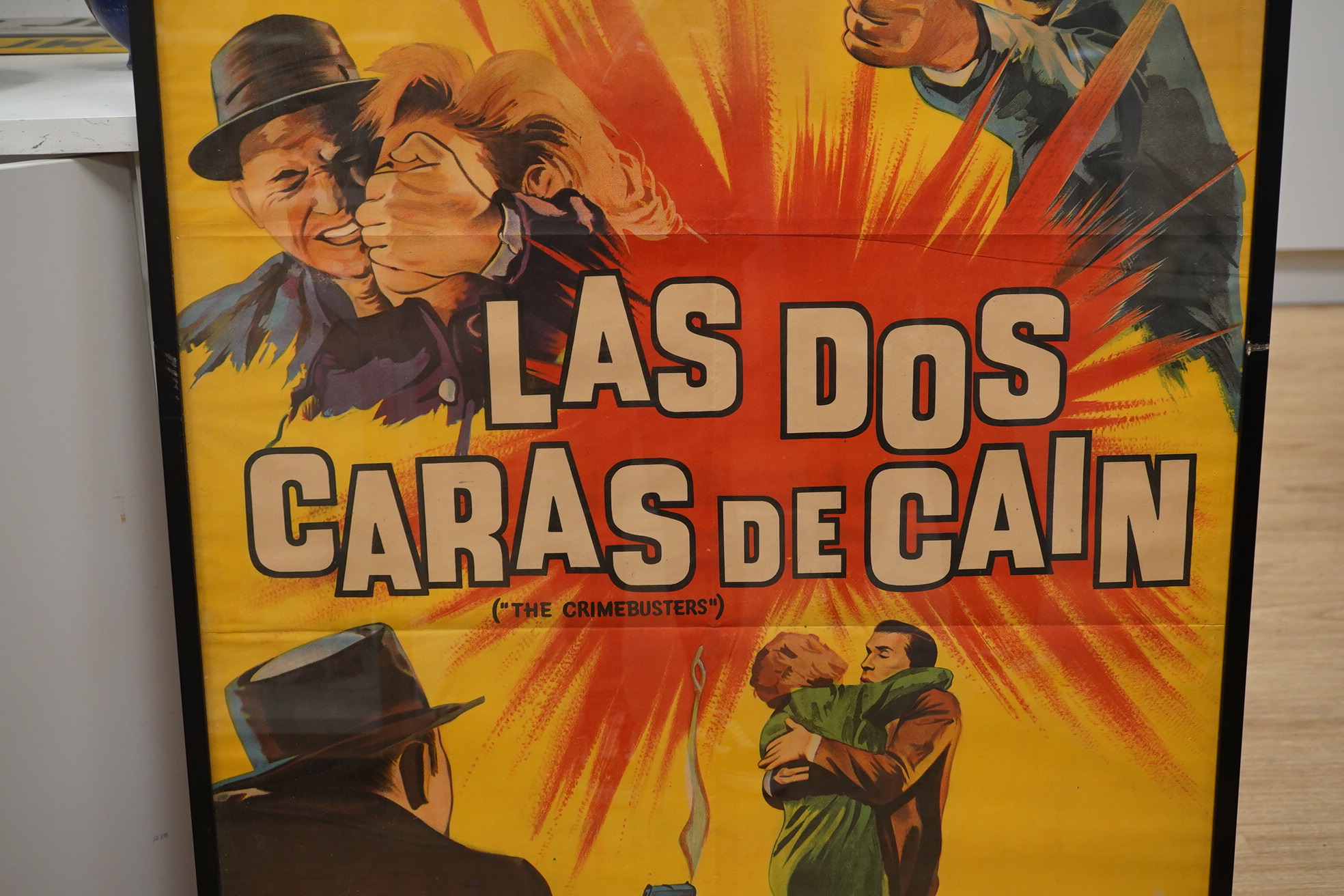 An Argentinian framed 1960s film poster for Las Dos Caras de Cain (The Crimebusters), 1962. Condition - fair to good